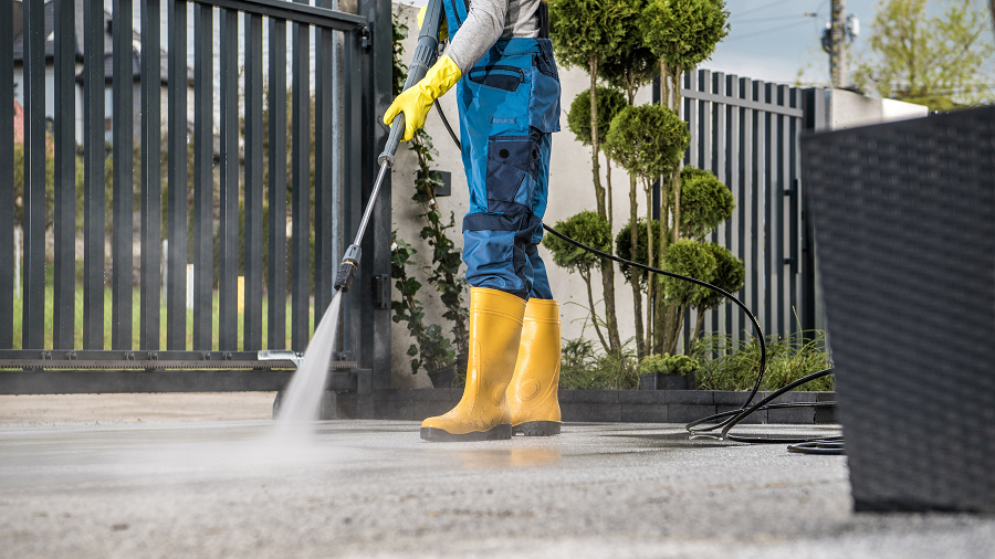 Pressure washer being used on outdoor floor